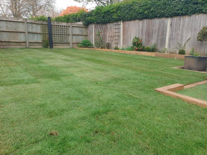 Finished landscaped garden with lawn and timber edging